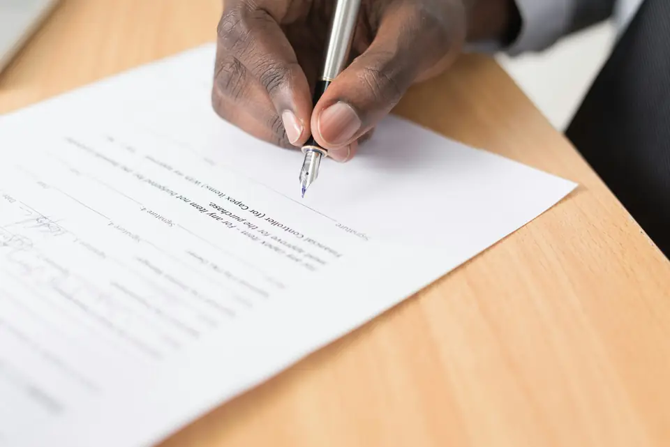 Hand signing a freight contract
