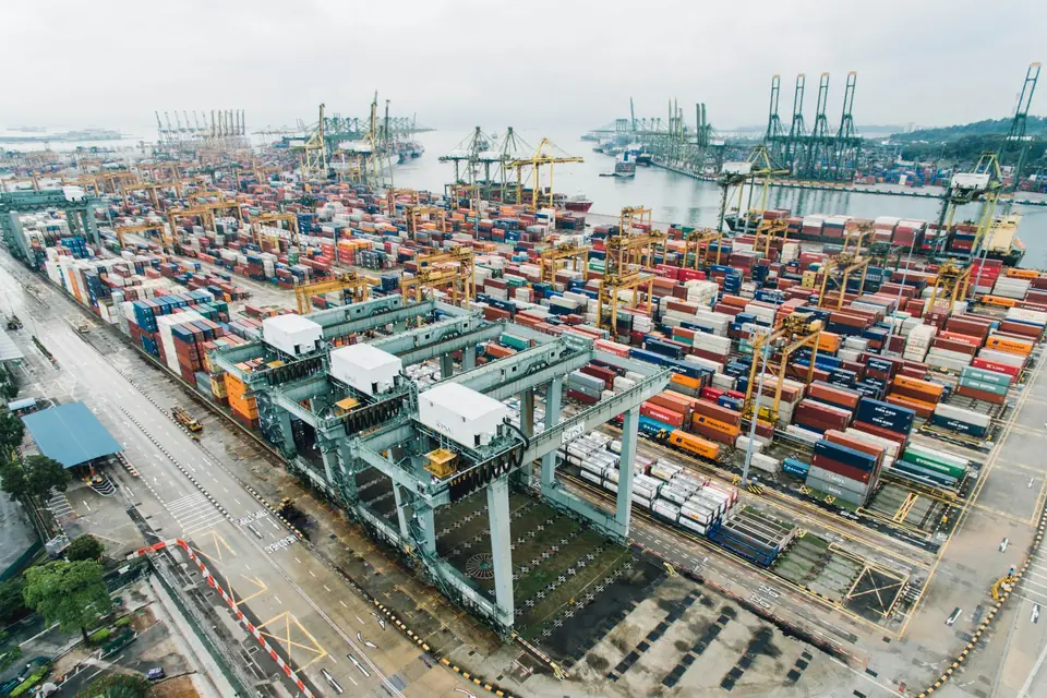 Container terminal seen from above, stacks of containers and gantry cranes