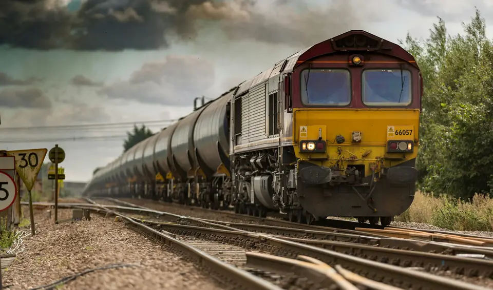 Freight locomotive pulling tank wagons